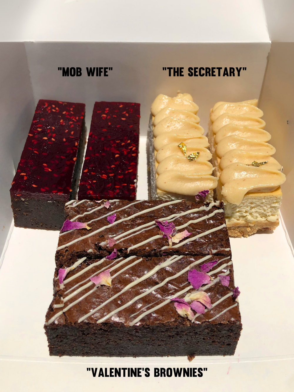 Valentine's Day Dessert Box featuring six gluten free dessert bars: chocolate mud cake with raspberry pate, rose petal brownies, and cheesecake bars